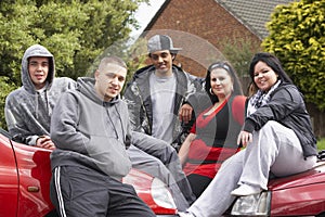Gang Of Youths Sitting On Cars