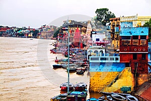 Ganges river aerial view in Varanasi, India. Ghats with boats in the morning