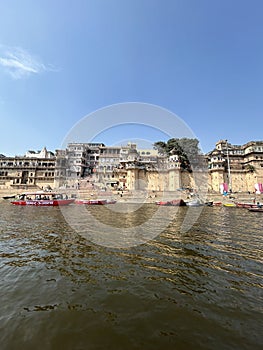 Ganges river with boats docked near the steps. Varanasi, Uttar Pradesh, India