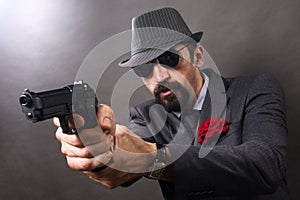 Gangster aiming with pistol