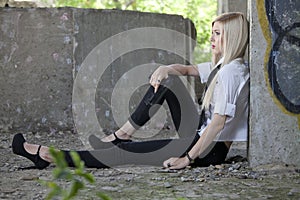 Gangster girl resting on the ground