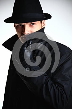 Gangster man in hat and coat