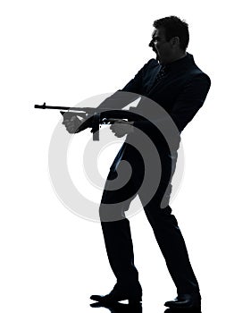 Gangster man holding thompson machine gun silhouette