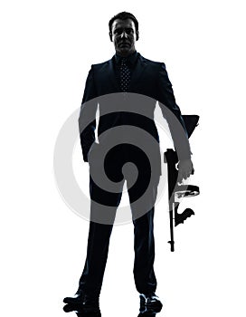 Gangster man holding thompson machine gun silhouette