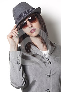 Gangster woman wearing a hat and looking