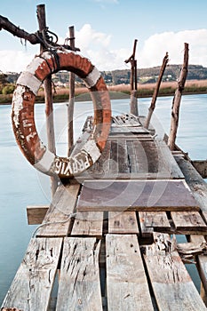 Gangway over the water and a lifebuoy