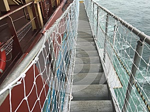 Gangway with safety net entrance to the vessel