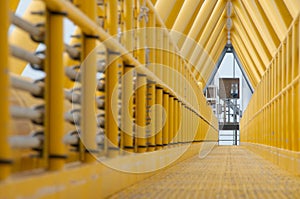 Gangway or walkway linked between production platform and living quarter.