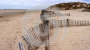 Ganivelle, a wooden coastal protection barrier on the beach of Sainte CÃ©cile Plage in Picardie photo