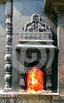ganpati bappa Indian vintage temple (Hindu god) sculpture orange vintage old temple