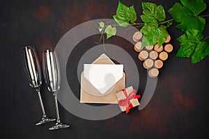 Gape bunch of cork with leaves, two wineglass, cork, envelope an