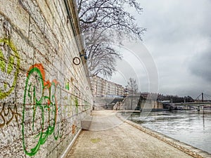The gaphic wall in the side walk of the river park, Lyon old town, France
