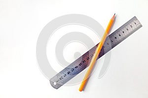 Gaphite simple wood pencil with ruler on table isolated