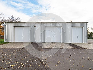 Garage building made of concrete with roller shutter doors. Modern building photo