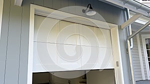 Garage Door Opening Move Up to Ceiling. Outside view footage