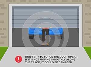 Garage door safety tips and rules. Man trying to open door by hands.
