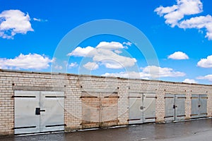 Garage doors under a blue sky