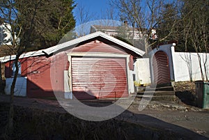 Garage and gate built in wood and masonry.