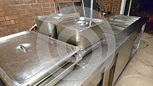A large bain marie serving counter in storage photo