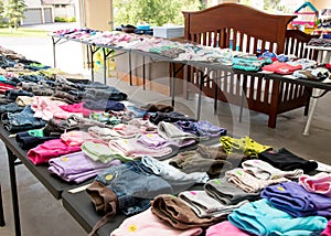 Garage sale tables with clothing