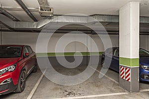 Garage space delimited with white paint in a residentia