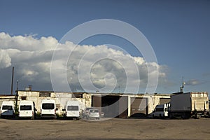 Garage for transport. Bus parking. Industrial zone with private cars