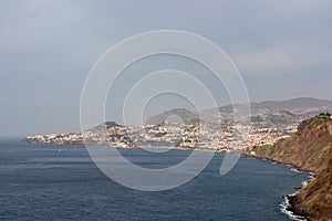 Garajau - Panoramic view city of Funchal seen from Cristo Rei in Garajau, Madeira island, Portugal, Europe. Majestic coastline