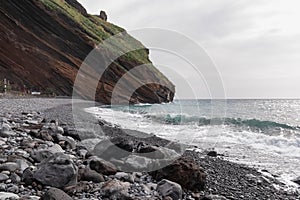 Garajau - Panoramic view of idyllic volcanic black stone beach of Praia Garajai, Canico, Madeira island, Portugal, Europe