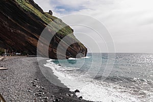 Garajau - Panoramic view of idyllic volcanic black stone beach of Praia Garajai, Canico, Madeira island, Portugal, Europe