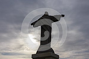 Garajau - Silhouette of majestic statue of Christ the King statue (Cristo Rei) in Garajau, Madeira island, Portugal, Europe