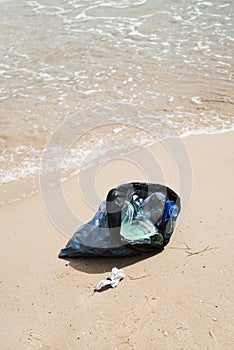 Garbage bag on the beach