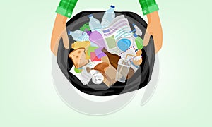 Garbage bag and hand holding in top view, bag plastic waste and a lot of rubbish, stack paper glass and bottle plastic waste,
