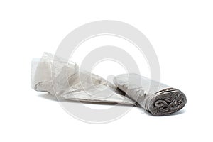 Garbage bag isolated on white background. Roll of plastic garbage bag for trash waste. New Biodegradable black Roll. Close-up.