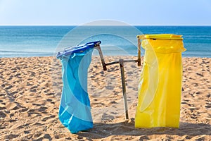 Garbage bags on  coast with beach and sea