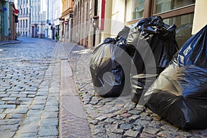 Garbage bags on an empty street