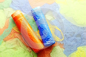 Garbage bags rolls on a color background