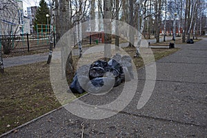 Garbage bags on the street in Russia. Territory cleaning.