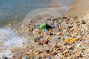 Garbage on a bank of ocean. Pollution of sea, ocean water with waste, plastics garbage