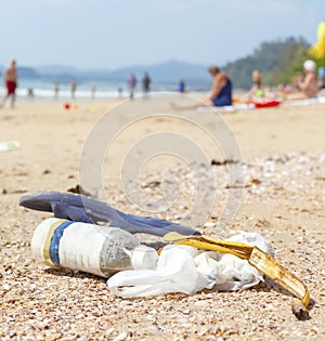 Garbage on a beach, nature pollution concept picture.