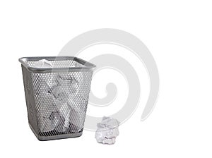 Garbage bin with paper waste isolated on white