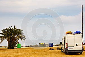 Garbage bins and campers on coast in Spain