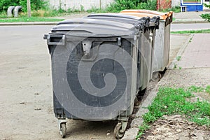 Garbage bins in a row in the city