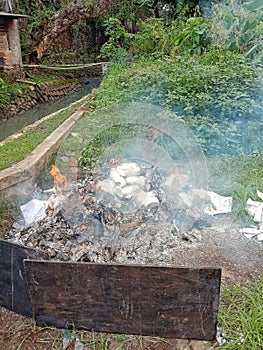 garbage burn pile in garden