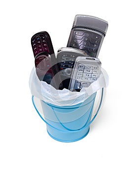 Garbage can filled with old cell phones