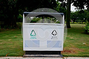 Garbage can with garden grass