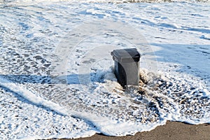 Garbage can in the tidal wave