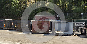 Garbage containers for auto-bottles stand on the territory of the processing plant