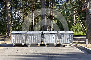 garbage containers on the site in the city park