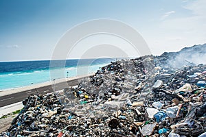 Garbage dump area view full of litter, plastic bottles,rubbish and other trash at the Thilafushi tropical island