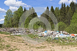 Garbage dump in the forest road